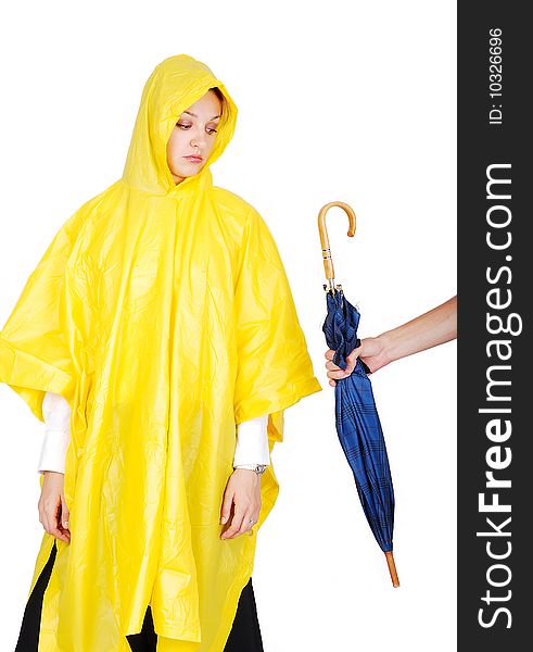 Nice model in yellow hood has been offered an umbrella