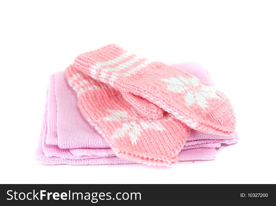 Baby`s hand-made pink mittens with pattern and scarf. Baby`s hand-made pink mittens with pattern and scarf
