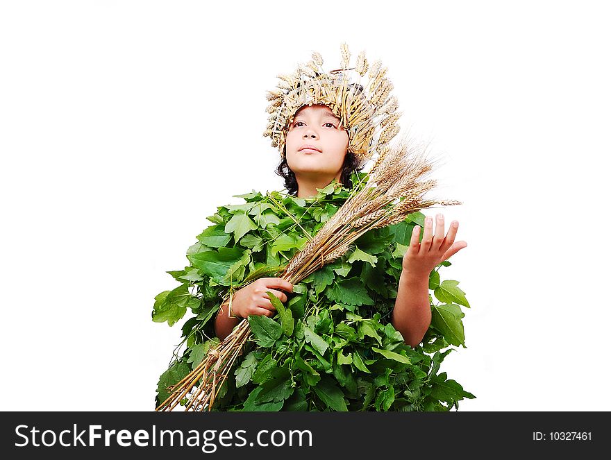 Nice little girl in leafs cloths with wheat hat on head