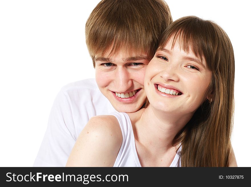 Laughing young couple on white background. Laughing young couple on white background