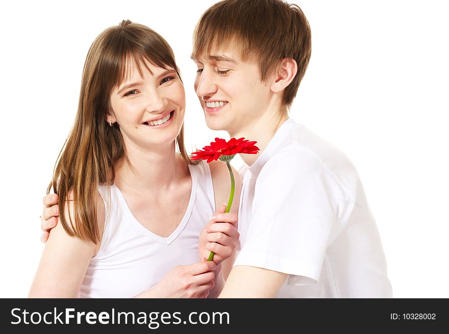 Laughing young couple with red flower. Laughing young couple with red flower