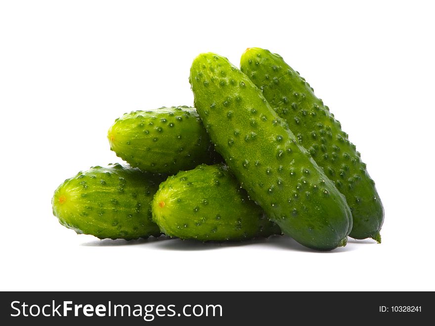 Fresh cucumbers on studio white