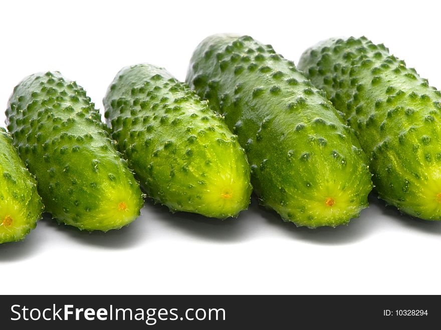 Fresh cucumbers on studio white