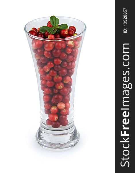 Cranberries in glass on white background.