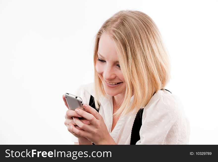Young woman using mobile looks coy or in love. Young woman using mobile looks coy or in love