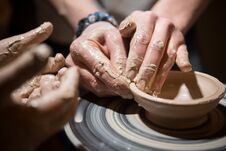 Child Learns To Make Pottery On The Potter`s Wheel Royalty Free Stock Photos