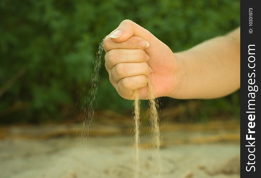Photo of hands with sand