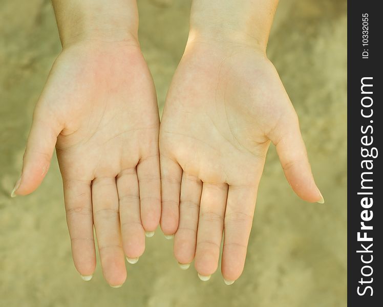 Photo of hands with sand