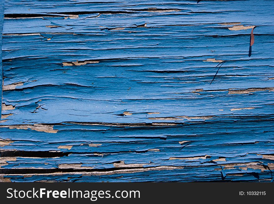 Peeling blue painted plank useful as background or texture. Peeling blue painted plank useful as background or texture