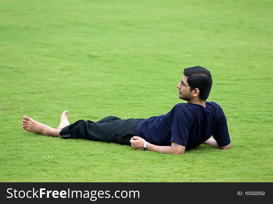 Men Relaxation Over Grass