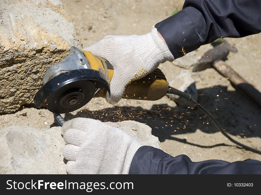 Worker hand with circular saw