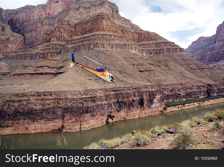 Chopper flying over Colorado River. Grand Canyon, West Rim. Arizona, USA. Chopper flying over Colorado River. Grand Canyon, West Rim. Arizona, USA.