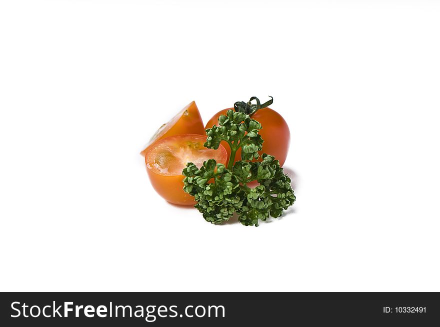 Cherry tomato and parsley on white background