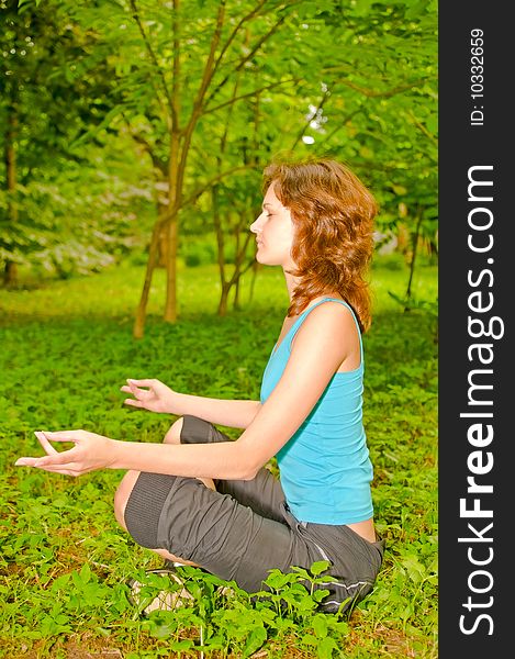 Young woman in meditating pose. Young woman in meditating pose