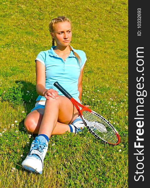 Girl is resting with tennis racket