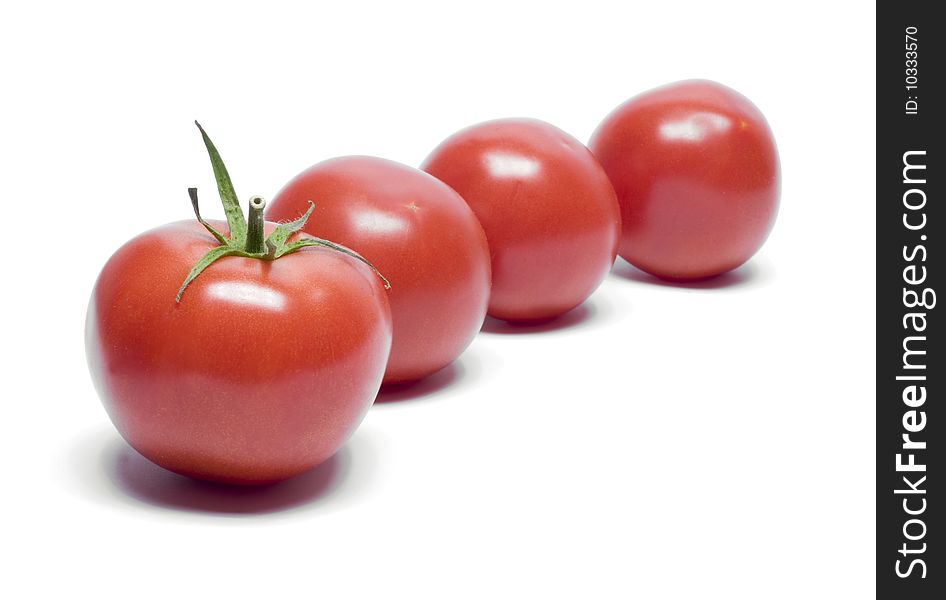 Four tomatoes which are presented on a white background