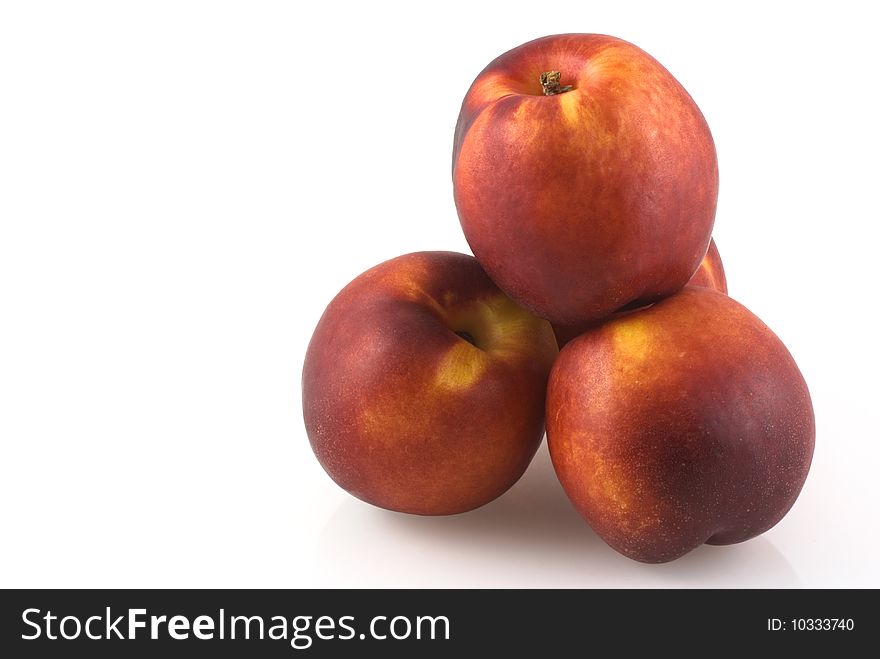 Pile of nectarines on a white background. Pile of nectarines on a white background.