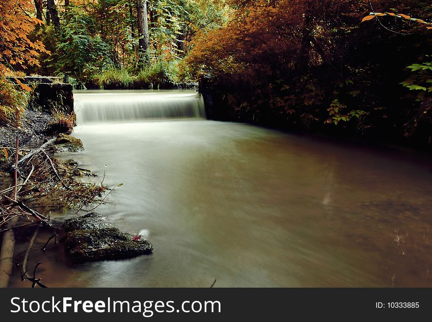 Autumn scene, waterfall in the forest