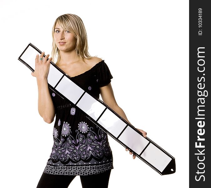 Beautiful young woman holding blank film strip against white background