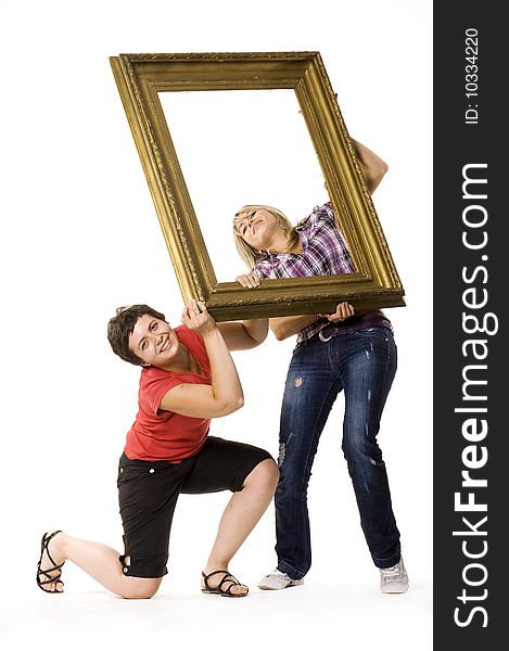 Young women holding wooden frame