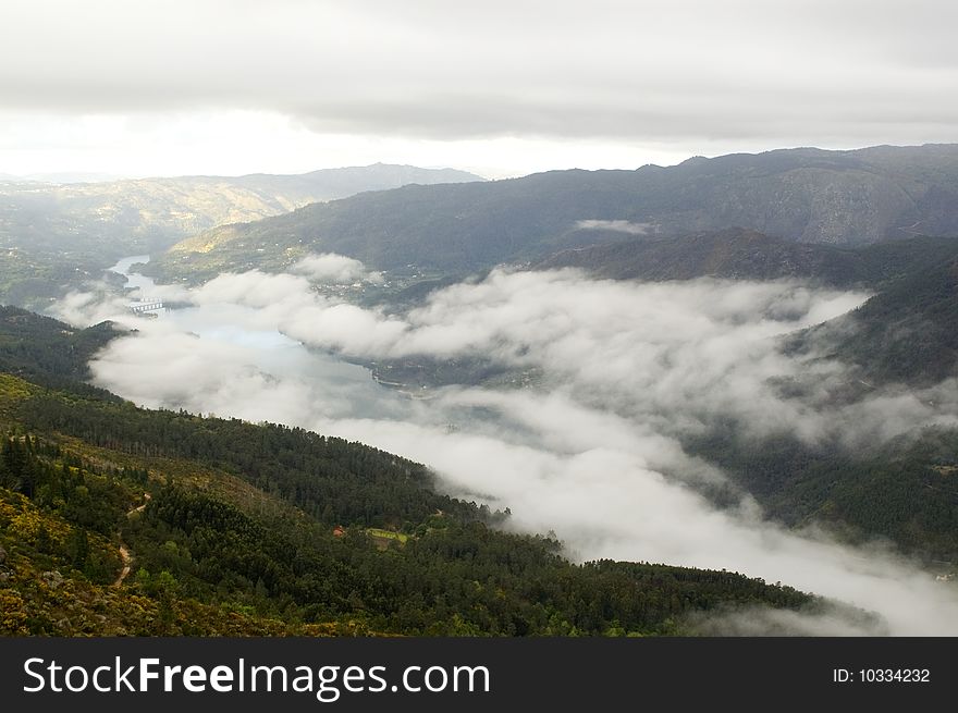 A beautiful and foggy landscape and mountains. A beautiful and foggy landscape and mountains