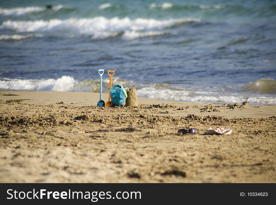 Children beach toys left in the sunset. Children beach toys left in the sunset