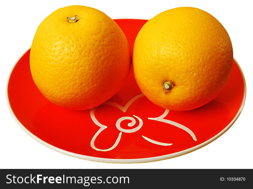 Two oranges on plate isolated on white background