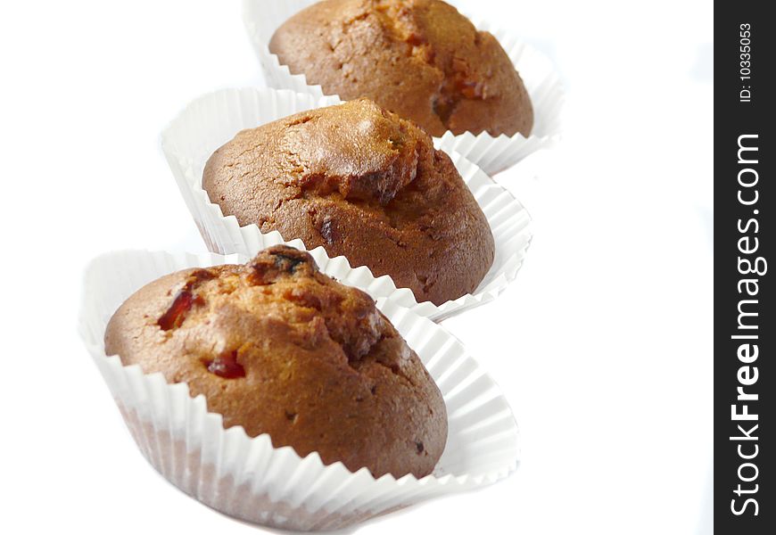 Fruit cupcakes isolated over white background. Shallow dof.