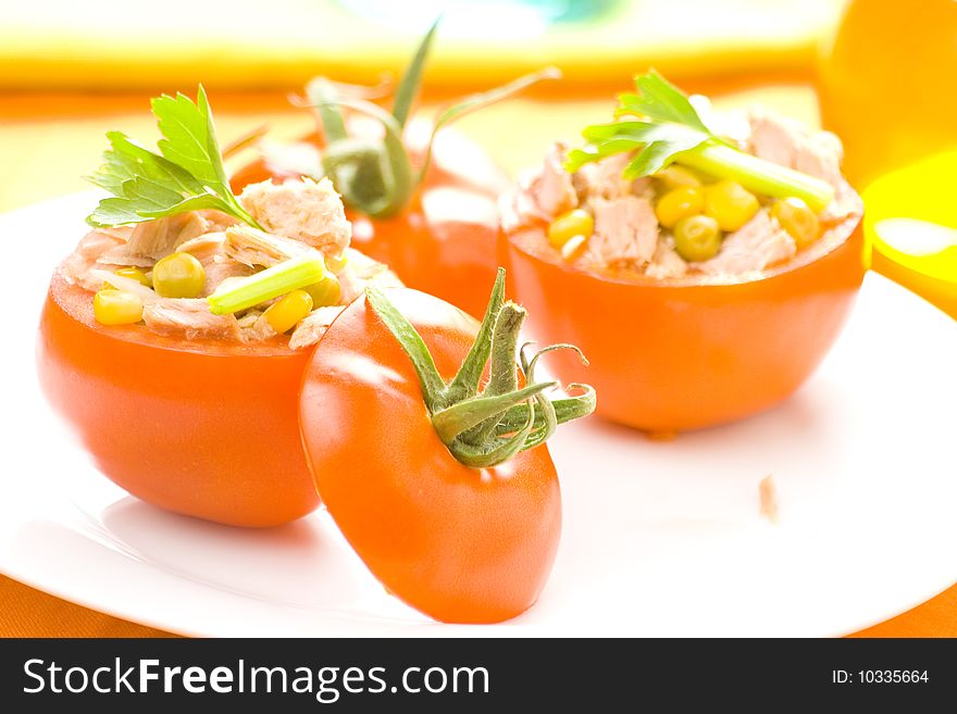 Tomatoes stuffed with tuna celery peas corn and soybeans. Tomatoes stuffed with tuna celery peas corn and soybeans