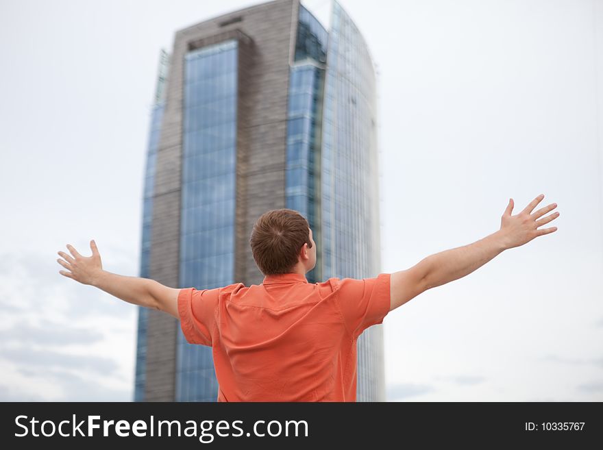 Young men standing - arms outstretched. Young men standing - arms outstretched