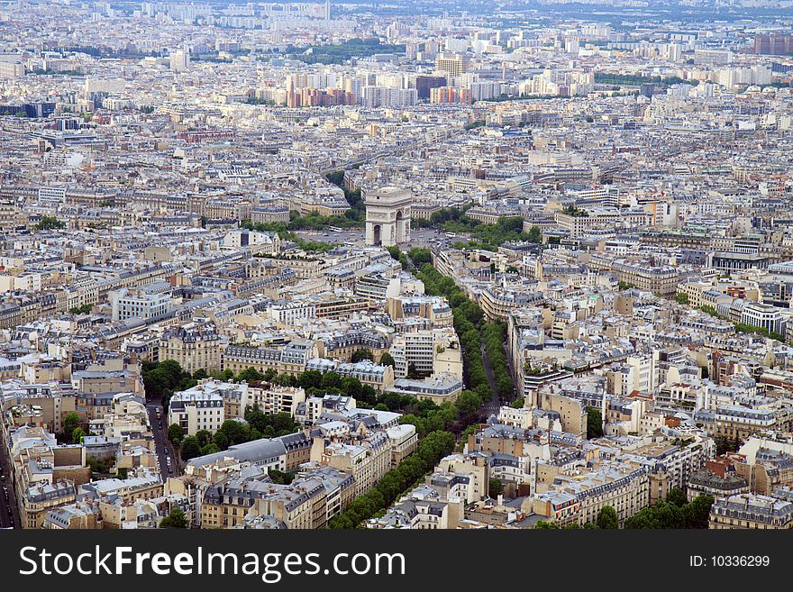 The skyline of Paris, France seen from the Eiffel Tower, with a focus on the Arc de Triomphe