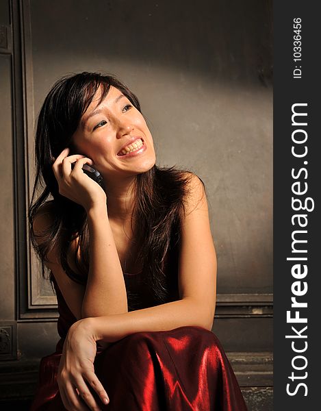 Beautiful Young Asian Woman With Mobile Phone