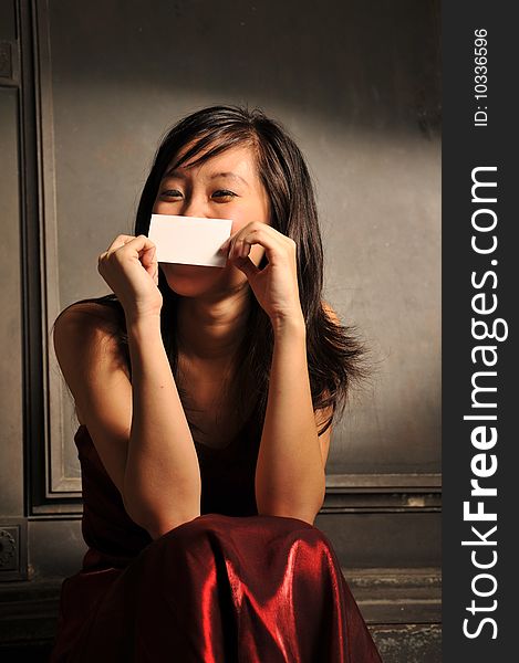 Beautiful Young Asian Woman Holding A Namecard