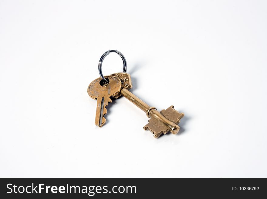 Two bronze keys isolated on white background. Two bronze keys isolated on white background