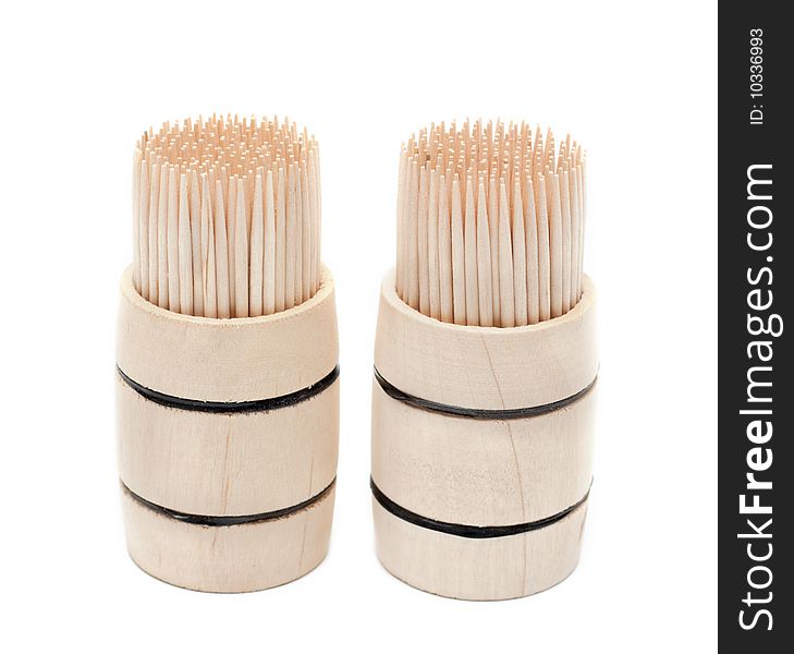 Birch of the toothpick in wooden cask on white background. Birch of the toothpick in wooden cask on white background