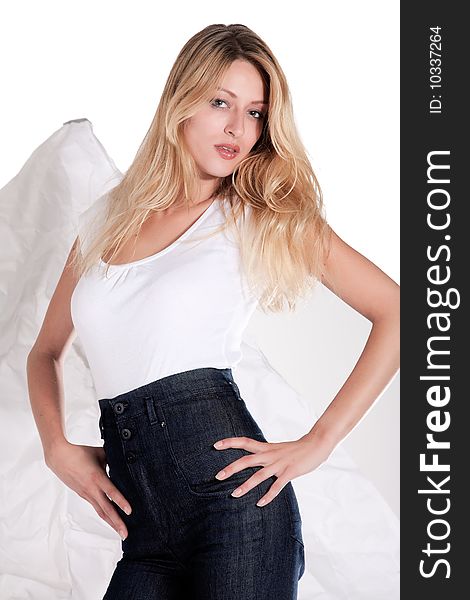 Beautiful blond young woman posing in jeans and shirt. Beautiful blond young woman posing in jeans and shirt