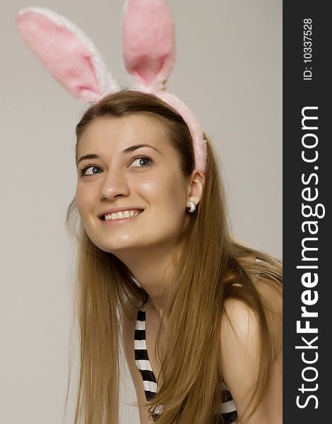 Girl in pink rabbit ears and handcuffs