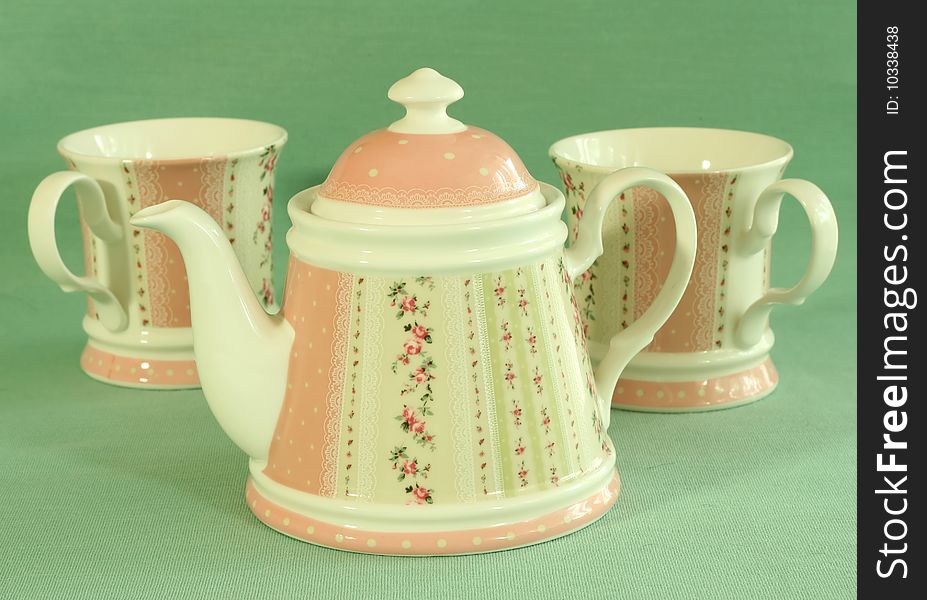 Beautiful tea service with ornament. Teapot and cups.