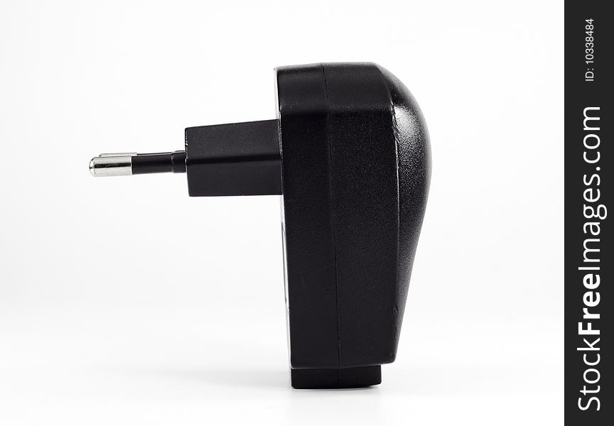 Black charger adapter for mobile on white background. Accessory.