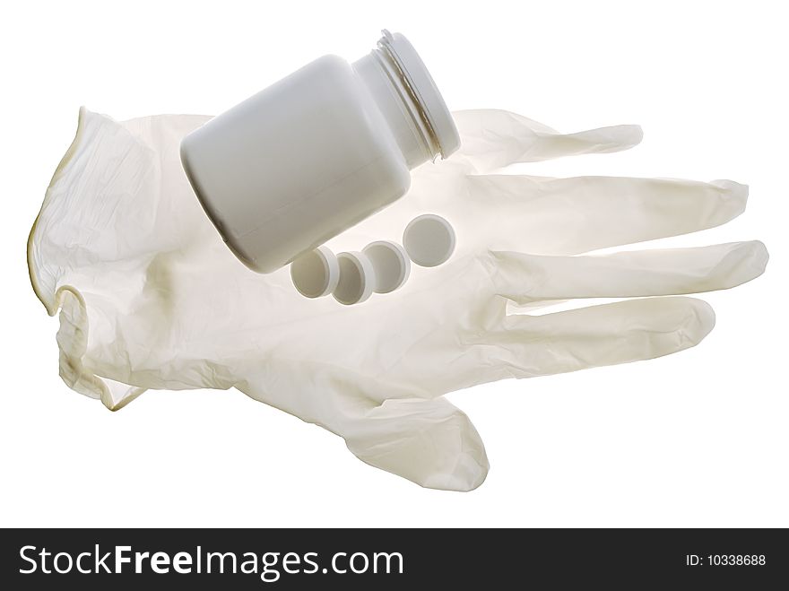 Glove and some pills on a white background