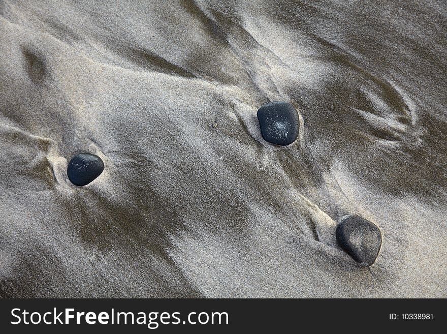 Sand bach with stones and track from surf. Sand bach with stones and track from surf