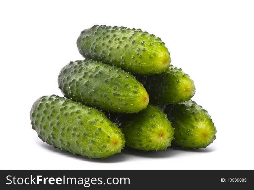 Fresh cucumbers on studio white