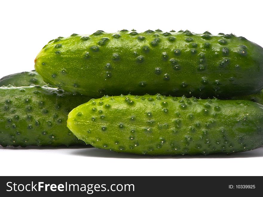 Fresh cucumbers on studio white