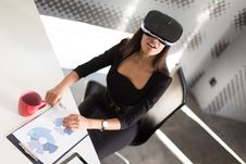 Good Looking Young Business Lady In Black Strong Suite Sit At The Office Table In Vr Glasses Royalty Free Stock Photo Good Looking Young Business Lady In Black Strong Suite Sit At The Office Table In Vr Glasses Royalty Free Stock Photo