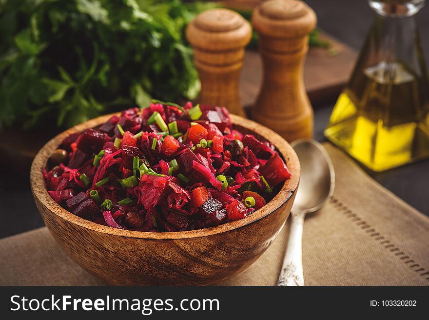 Vegetable salad with beetroot, carrot, pea and onion. Russian style cuisine.