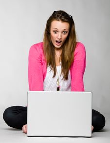 Attractive Young Woman Shocked By Her Laptop Stock Images