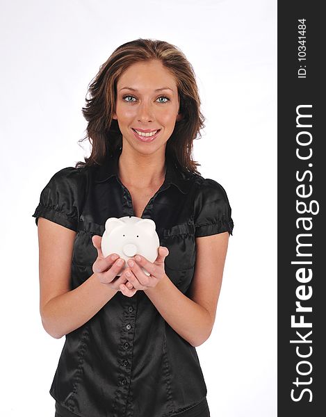 Businesswoman holding a piggy bank on a white background