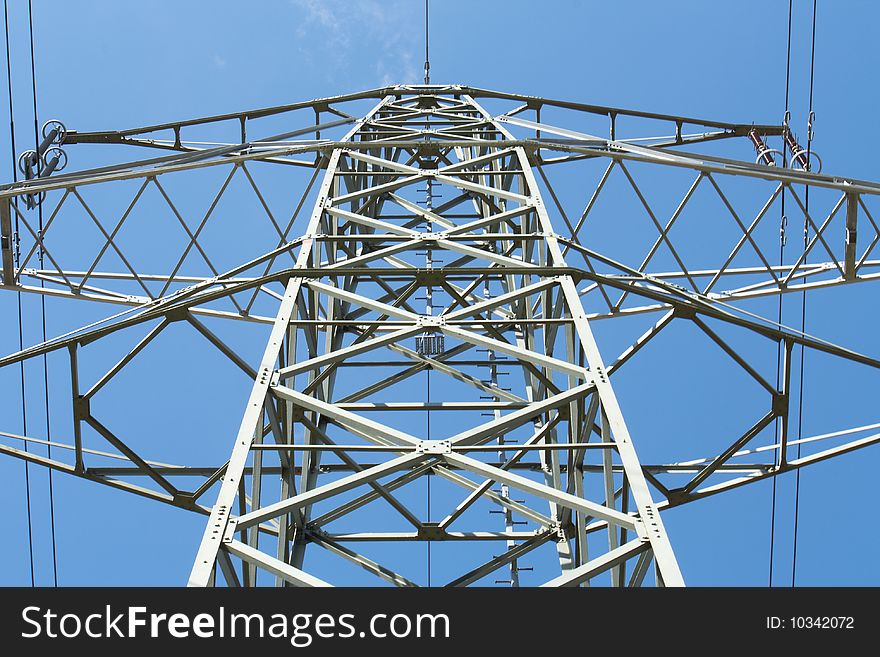 Electric power transmission on a background of the blue sky. Electric power transmission on a background of the blue sky