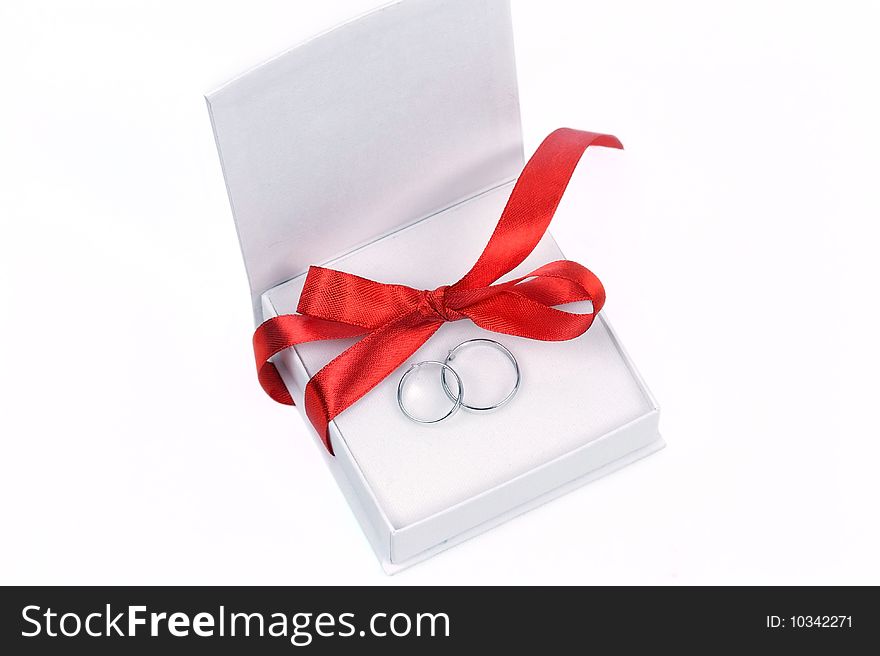 Closed up rings in white box isolated on white