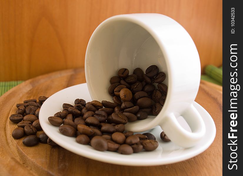 Coffee beans in  white cup
